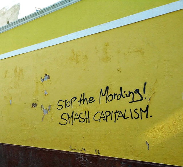 Ada Wanders/Włóczykijada. Writing on the wall in Lagos: Stop the Mording. Smash Capitalism.