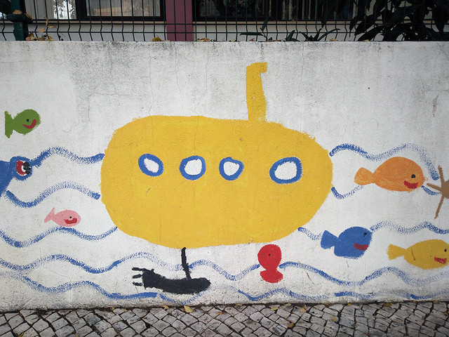 Ada Wanders/Włóczykijada. Picture of the yellow submarine on the school wall.